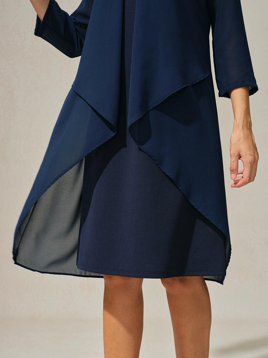 Robe en mousseline de soie verte à manches cape superposées
