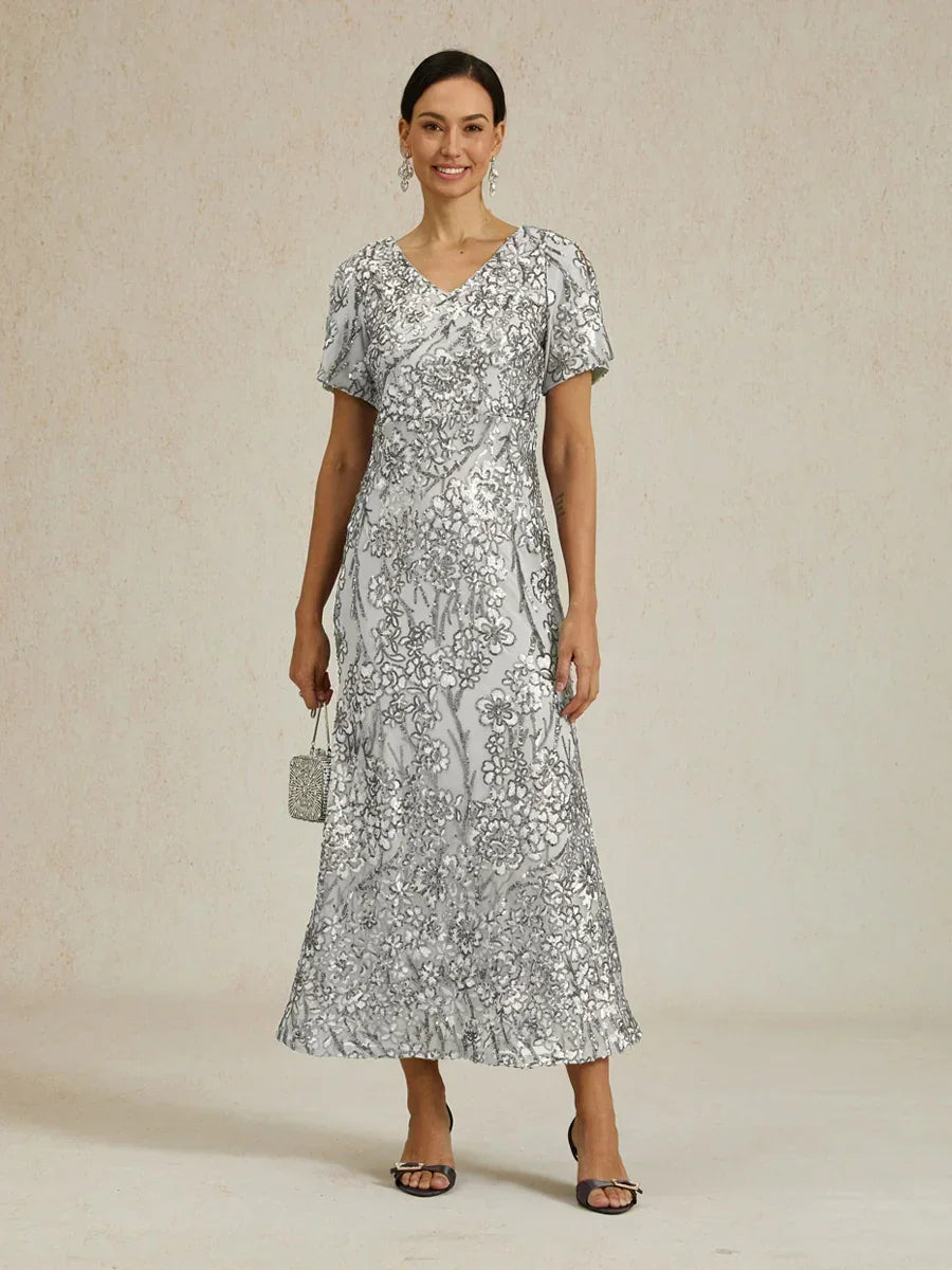 Elegantes Paillettenkleid mit V-Ausschnitt und kalten Schultern