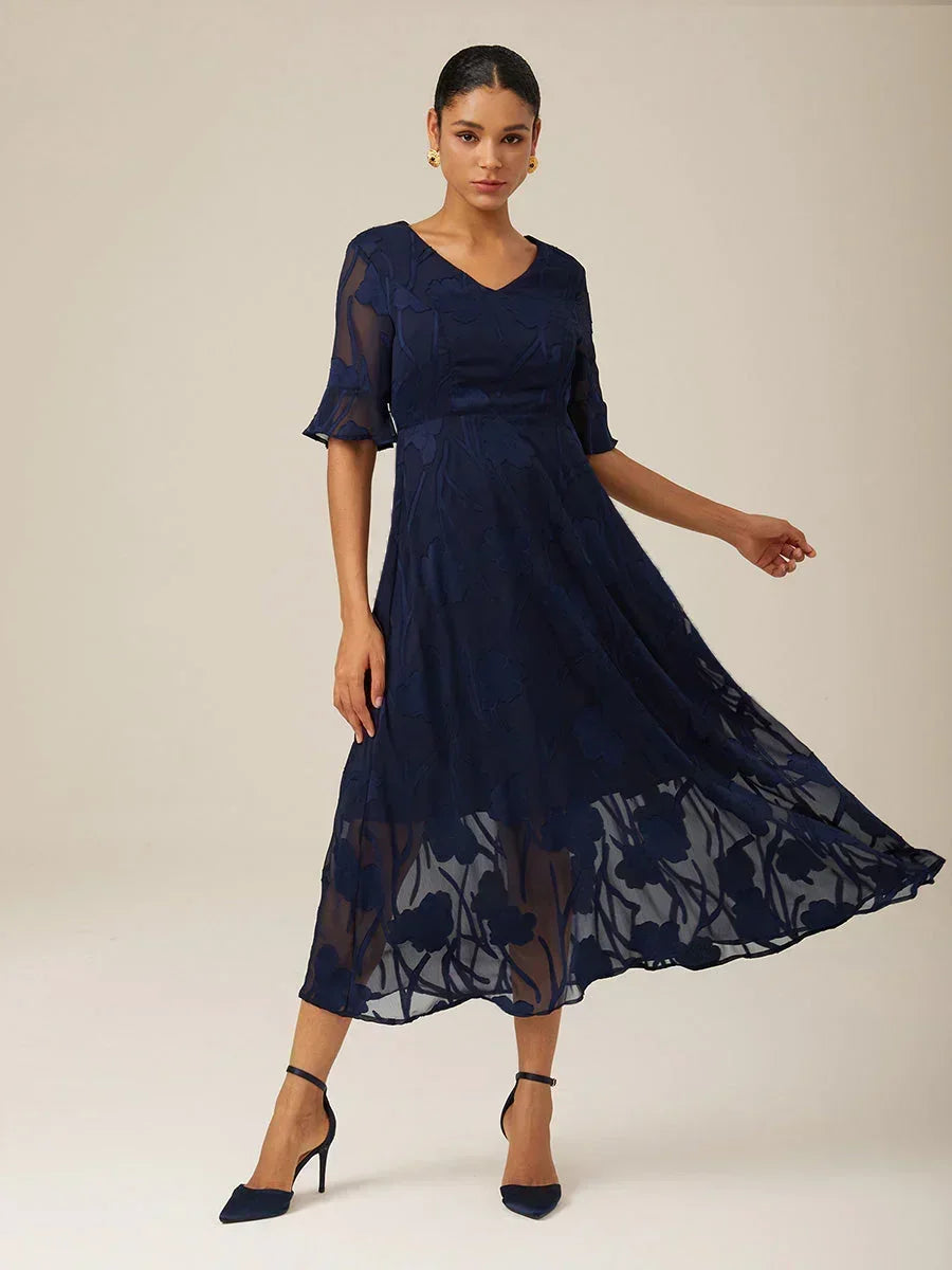 Maxikleid mit Rüschen und flatternder Spitze