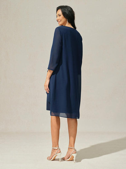 Robe en mousseline de soie verte à manches cape superposées