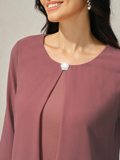 Robe en mousseline de soie verte à manches cape superposées