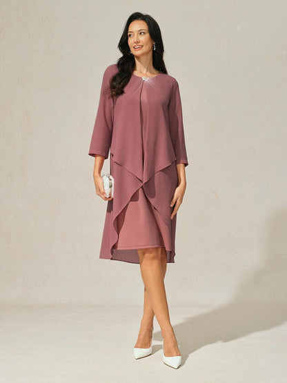 Robe en mousseline de soie verte à manches cape superposées