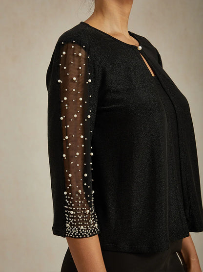 Elegante 3/4-Arm Metallic-Strickbluse