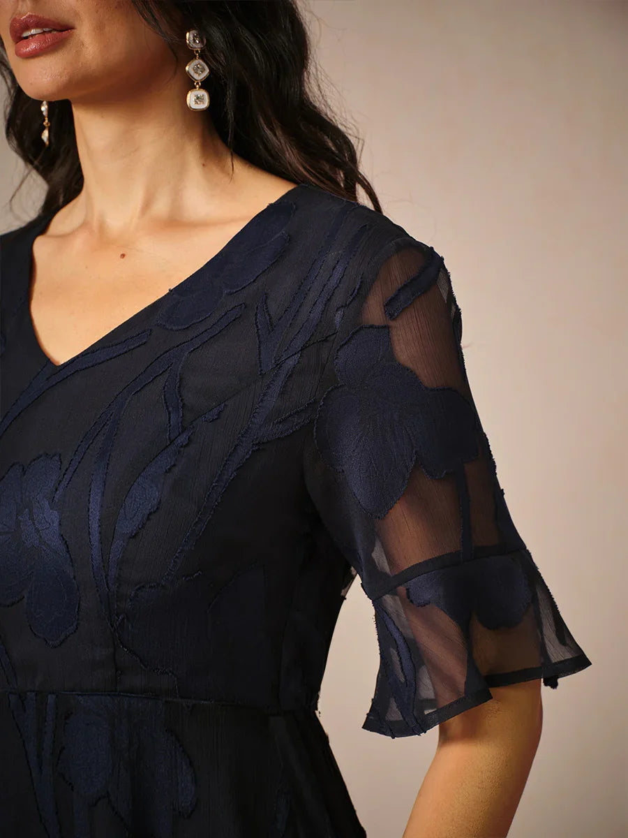 Maxikleid mit Rüschen und flatternder Spitze