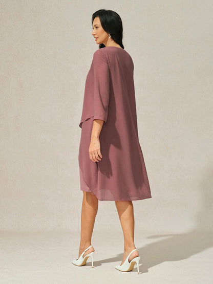 Robe en mousseline de soie verte à manches cape superposées