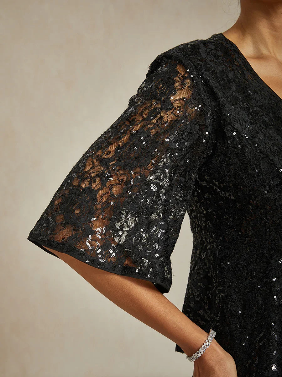 Elegantes Spitzentop mit Fledermausärmeln