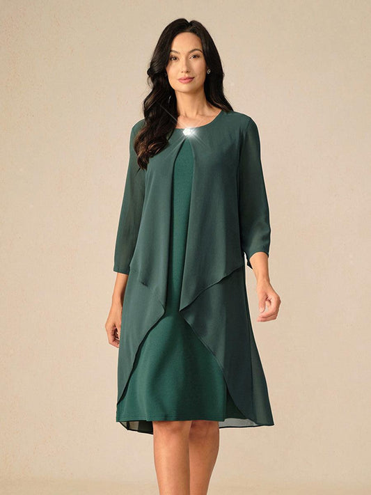 Robe en mousseline de soie verte à manches cape superposées