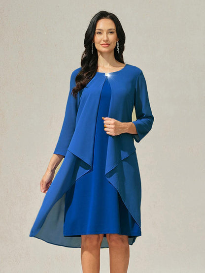 Robe en mousseline de soie verte à manches cape superposées