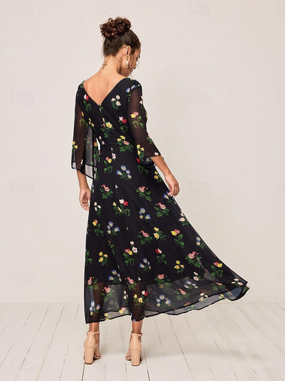 Robe longue fleurie à nœud torsadé
