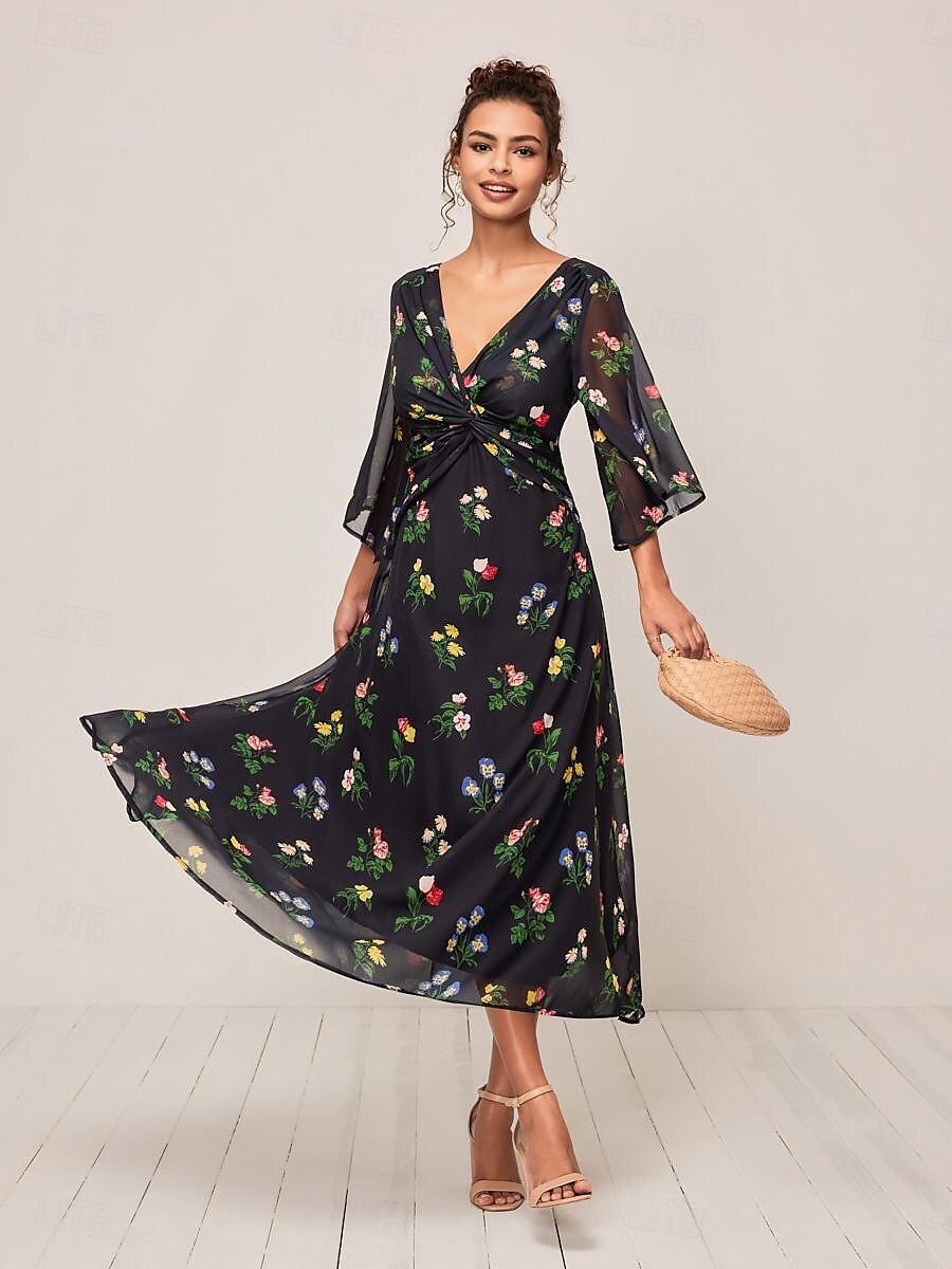 Robe longue fleurie à nœud torsadé