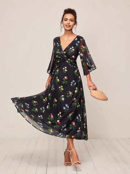 Robe longue fleurie à nœud torsadé