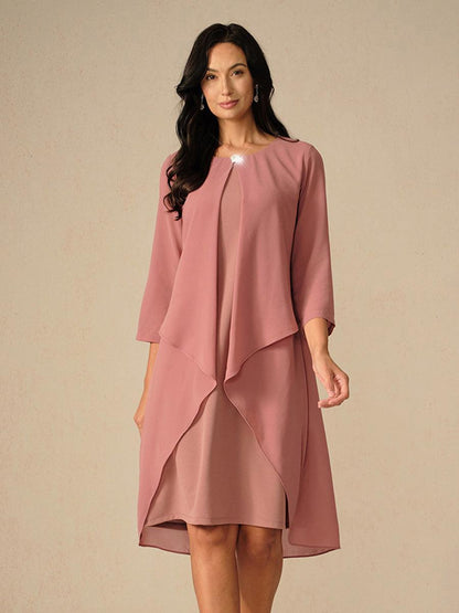Robe en mousseline de soie verte à manches cape superposées