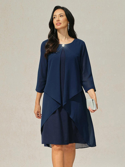 Robe en mousseline de soie verte à manches cape superposées